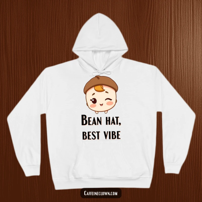 Funny, warm hoodie with a character wearing a coffee bean hat and winking, perfect for cozy coffee moments.
