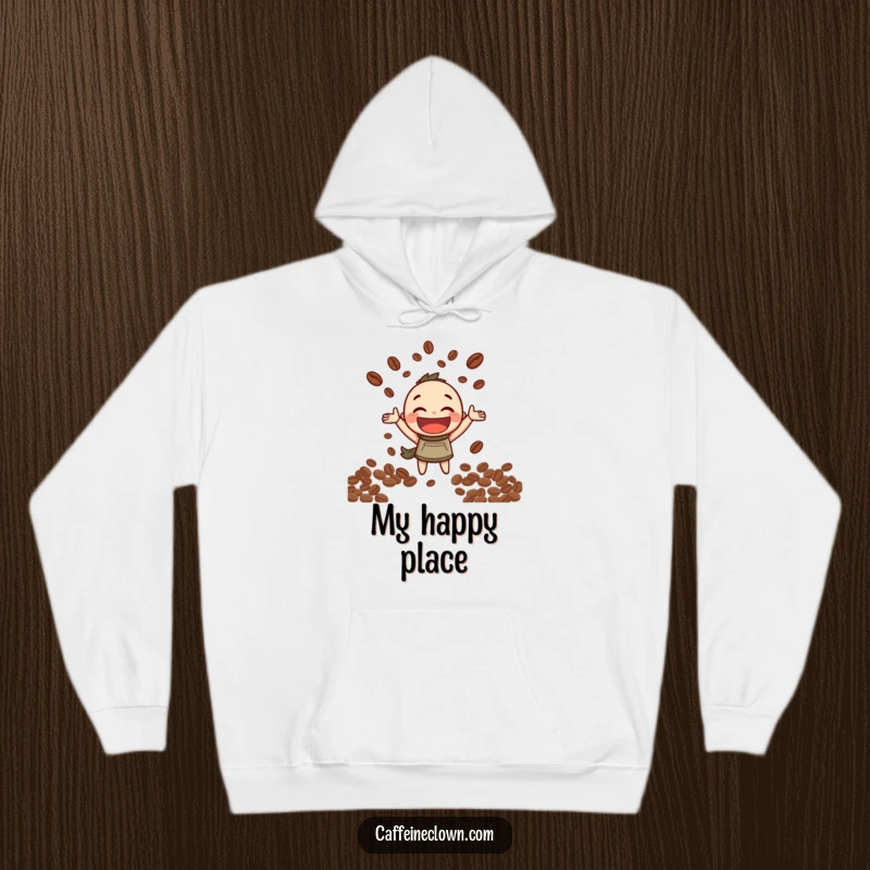 Funny Hoodie: Character with a broad smile joyfully juggles coffee beans, celebrating the art of coffee preparation.