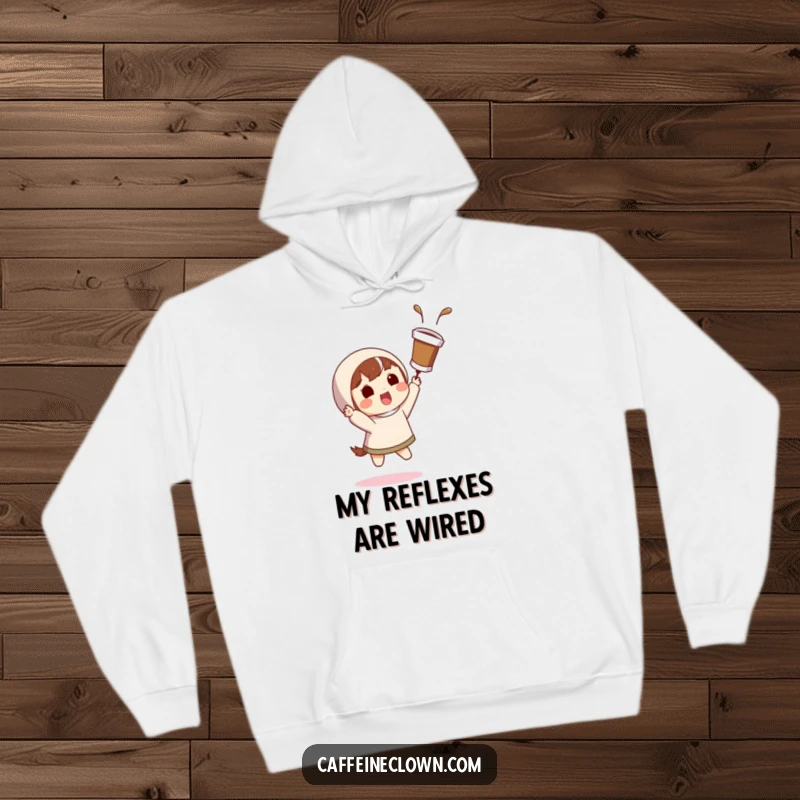 Funny, warm hoodie with a character catching a flying coffee cup with a surprised grin, perfect for coffee action fans.