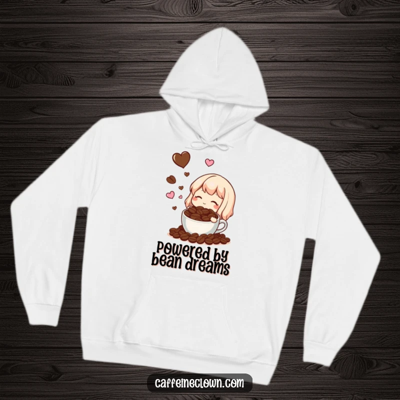 Funny, cozy hoodie featuring a character blissfully dreaming of coffee beans and tiny hearts, perfect for coffee enthusiasts.